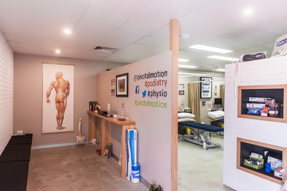 A waiting room and a view into a medical office | Featured image for Pivotal Motion Physio.