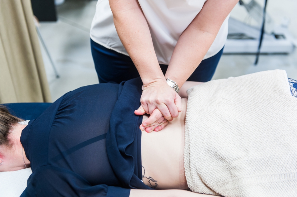 Patient receiving back treatment | featured image for Back Pain Tips blog for Pivotal Motion Physiotherapy.