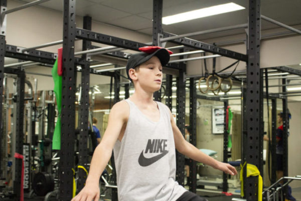 Teen exercising | Featured image for Why do Kids Dropout of Sport After School blog for Pivotal Motion Physiotherapy.