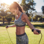 Woman preparing to jump rope | Featured image for the Benefits of a Warm Up blog from Pivotal Motion Physiotherapy.