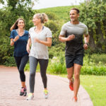 Three people running as part of their exercise routine | featured image for Regular Exercise Benefits Happy Chemicals blog for Pivotal Motion Physiotherapy.