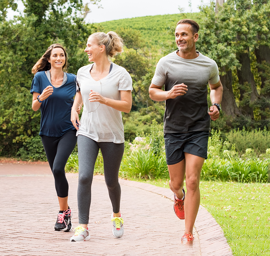 Three people running as part of their exercise routine | featured image for Regular Exercise Benefits Happy Chemicals blog for Pivotal Motion Physiotherapy.