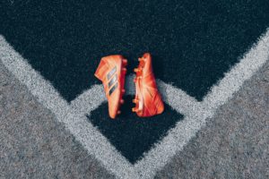 Orange Soccer Boots | Featured image for winter foot care tips.