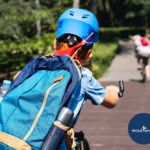 Kid riding bike to school | featured image for BACK TO SCHOOl! SECRETS TO A PAIN FREE EDUCATION blog.