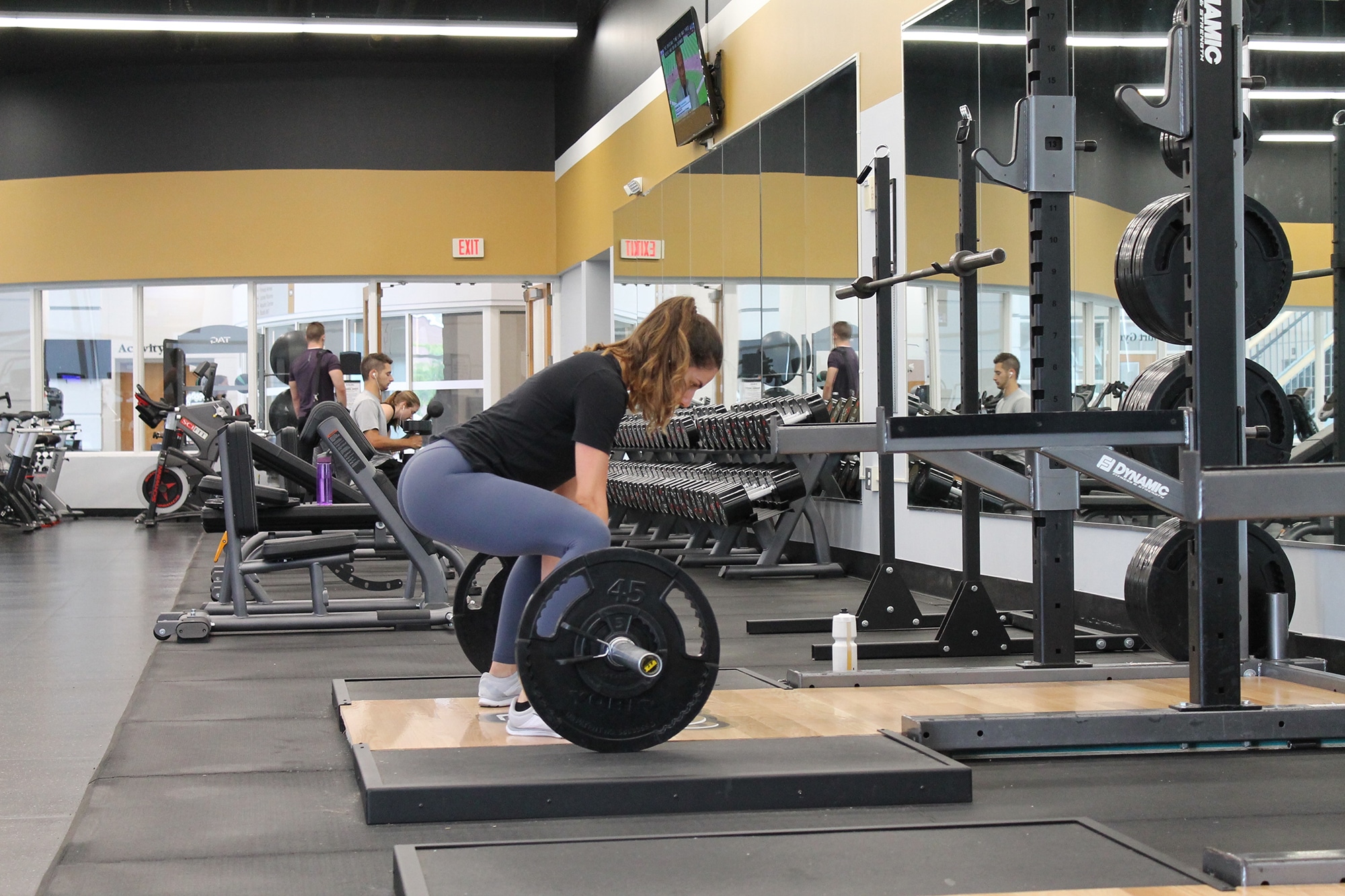 A woman performing deadlift - what is the posterior chain blog featured image.