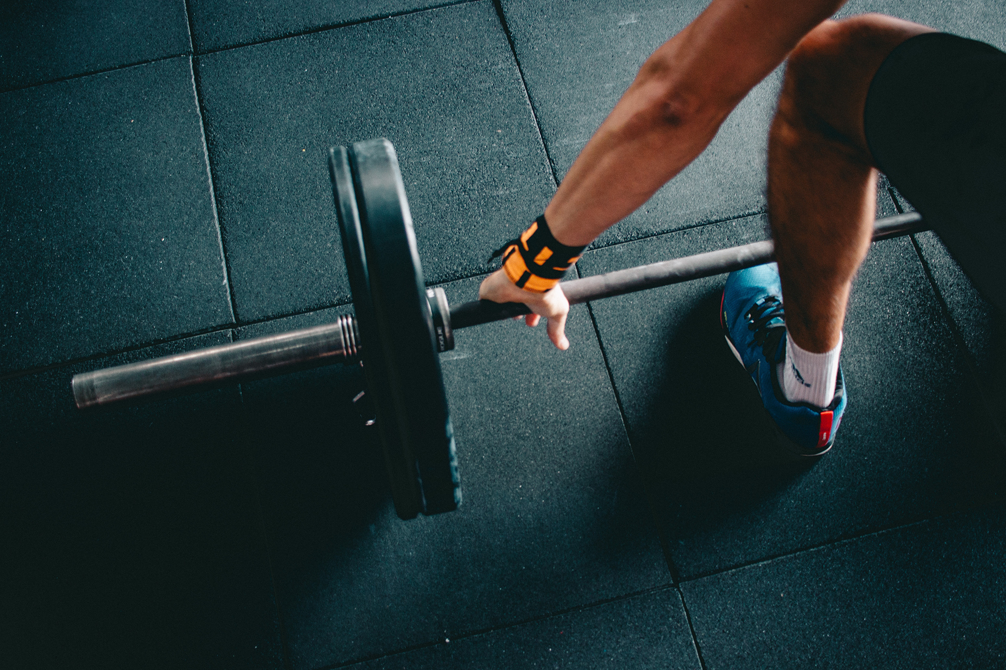 Up close image of someone about to lift weight