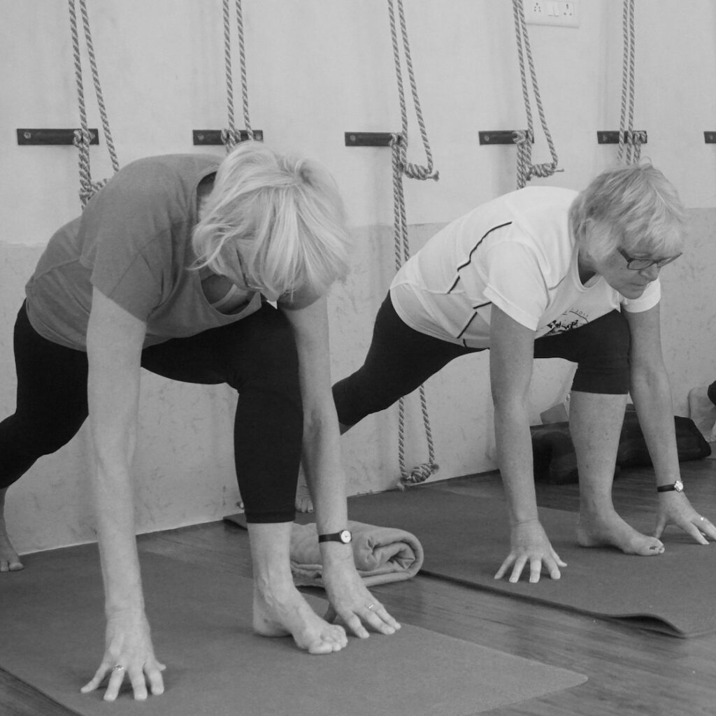 Image of two elderly woman doing stretches