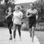 Group of adult people jogging