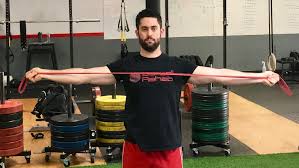 Man holding red exercise band