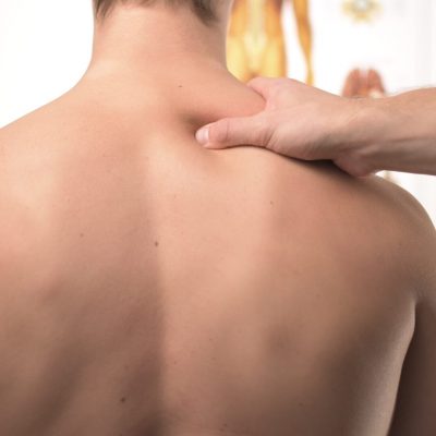 Image of person having shoulder massaged