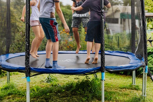 Why exercise is important in adolescence image of kids on trampoline