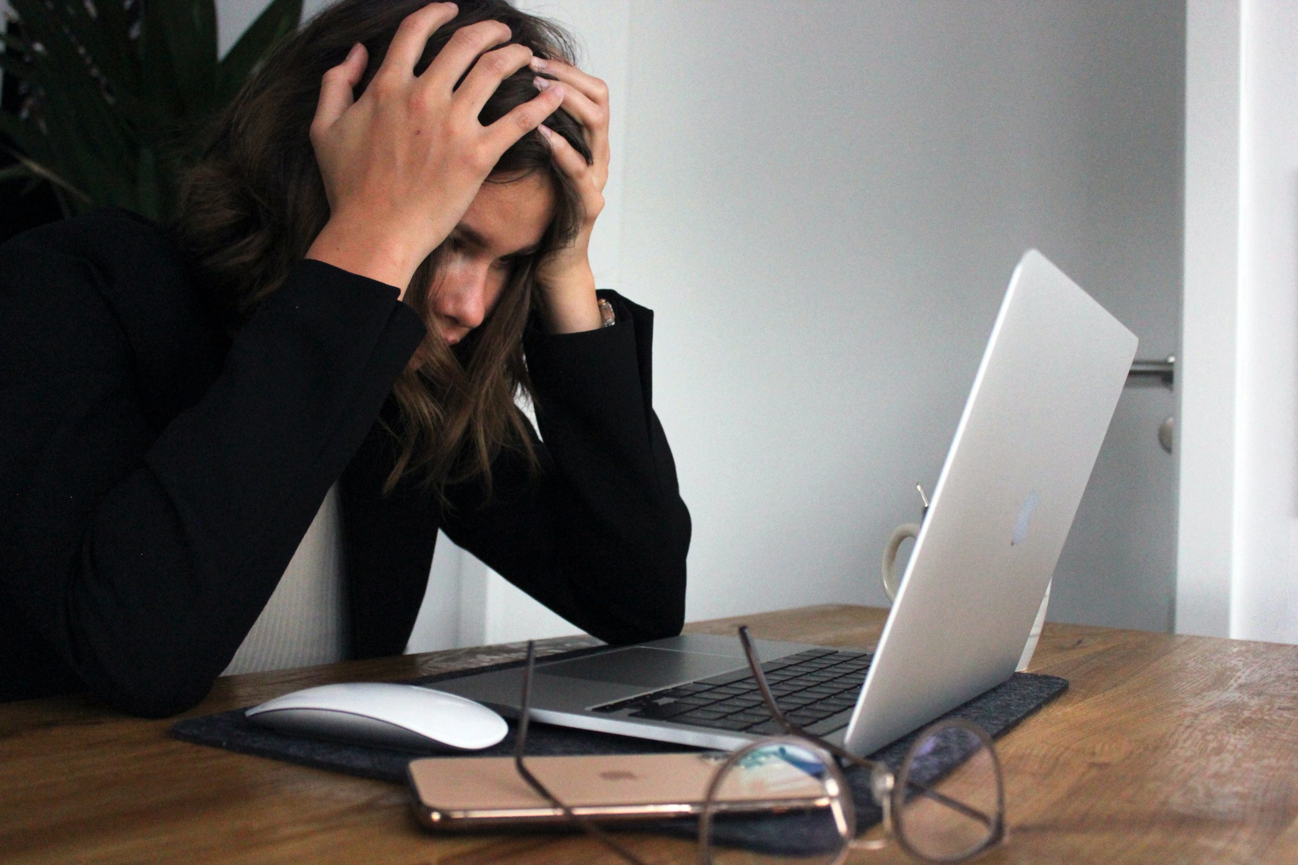 Lady looking at the laptop screen with a concern face | Pivotal Motion