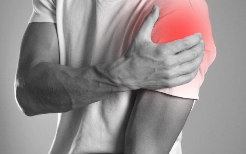 Guy holding his shoulder - Labrum tear | Featured Image for the Referred Shoulder Pain Treatment Page of Pivotal Motion Physiotherapy.