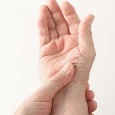 Full color image of left hand holding the right hand | featured image for Arm Physiotherapy.