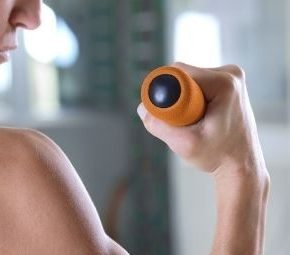 Person curling a weight bar with one hand | featured image for The Injured Biceps Muscle.