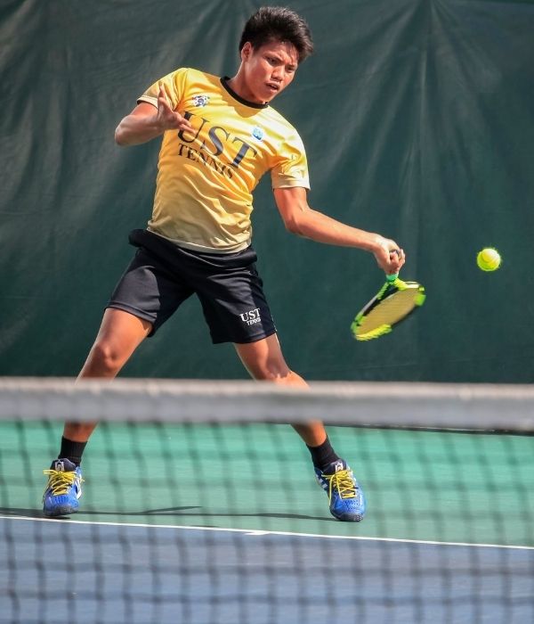 Man playing tennis | featured image for Painful Elbow.