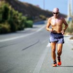 Running by the side of the road | Featured Image for Runner’s Knee