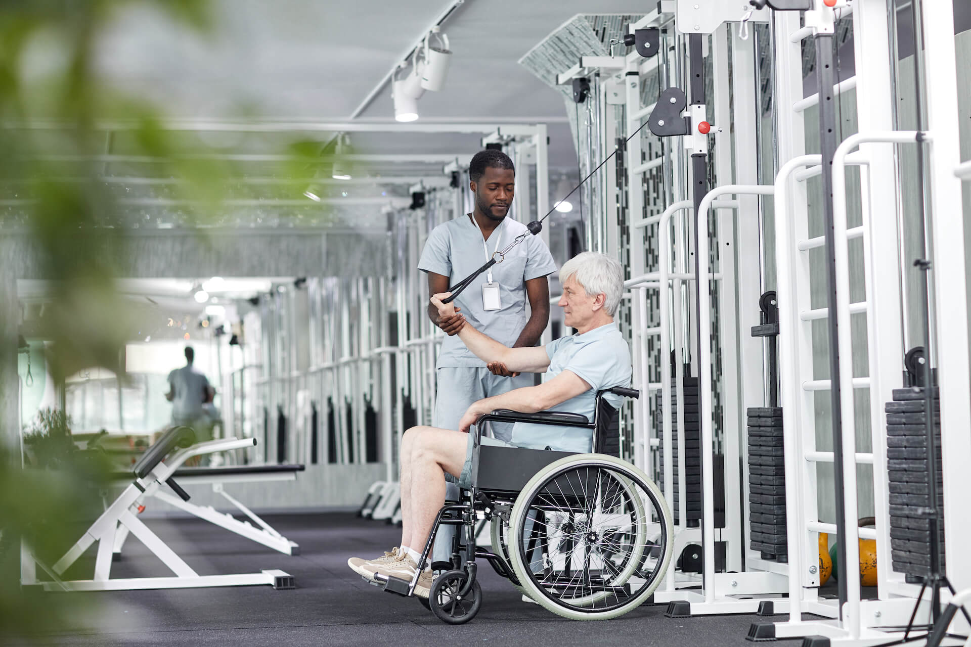 Photo of a doctor helping a patient do mobility exercises | Featured Image for Stone Man Syndrome blog for Pivotal Motion Physiotherapy.