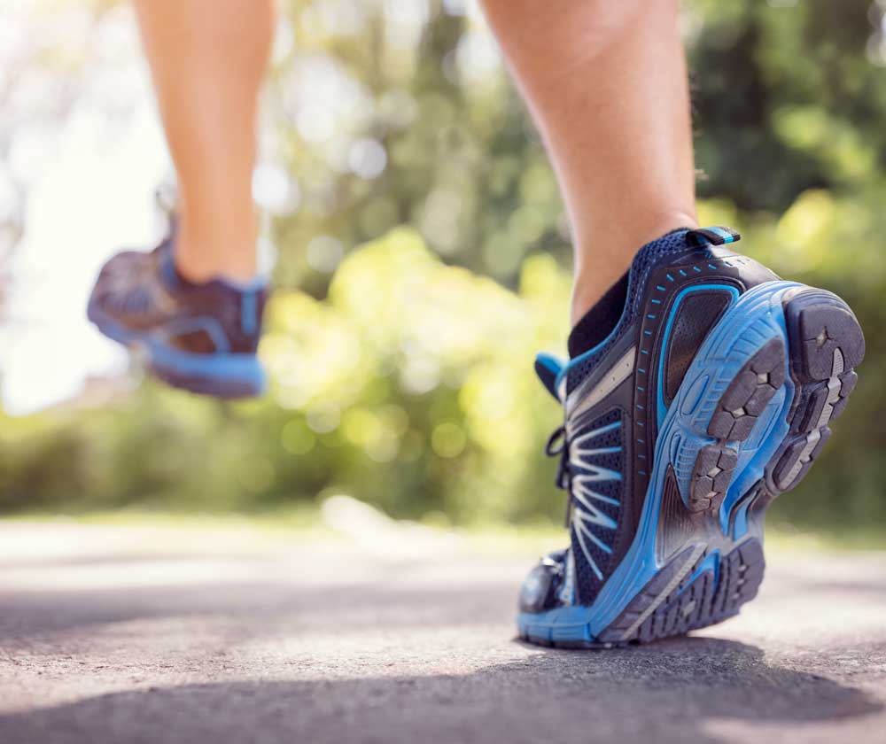 Running taking a big step | Featured Image for Feet & Ankle Physiotherapy