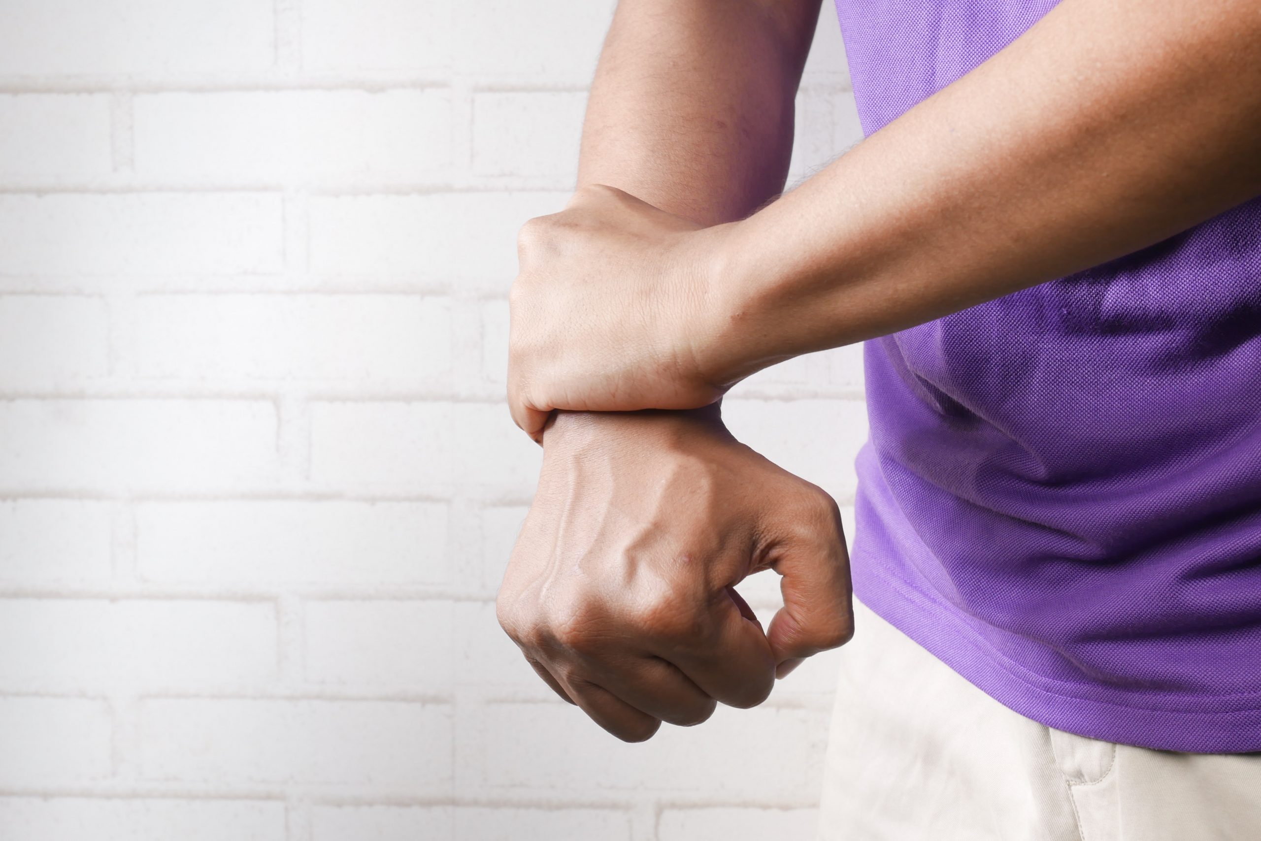 Hands of Male Patient is Doing Palm or Wrist Exercise with Spring