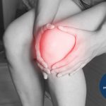 Person holding an injured knee | Featured Image for the Common Causes of Injury Blog by Pivotal Motion Physiotherapy