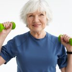 Lady lifting weights | Featured Image for the Osteoporosis Explained Blog by Pivotal Motion Physiotherapy.