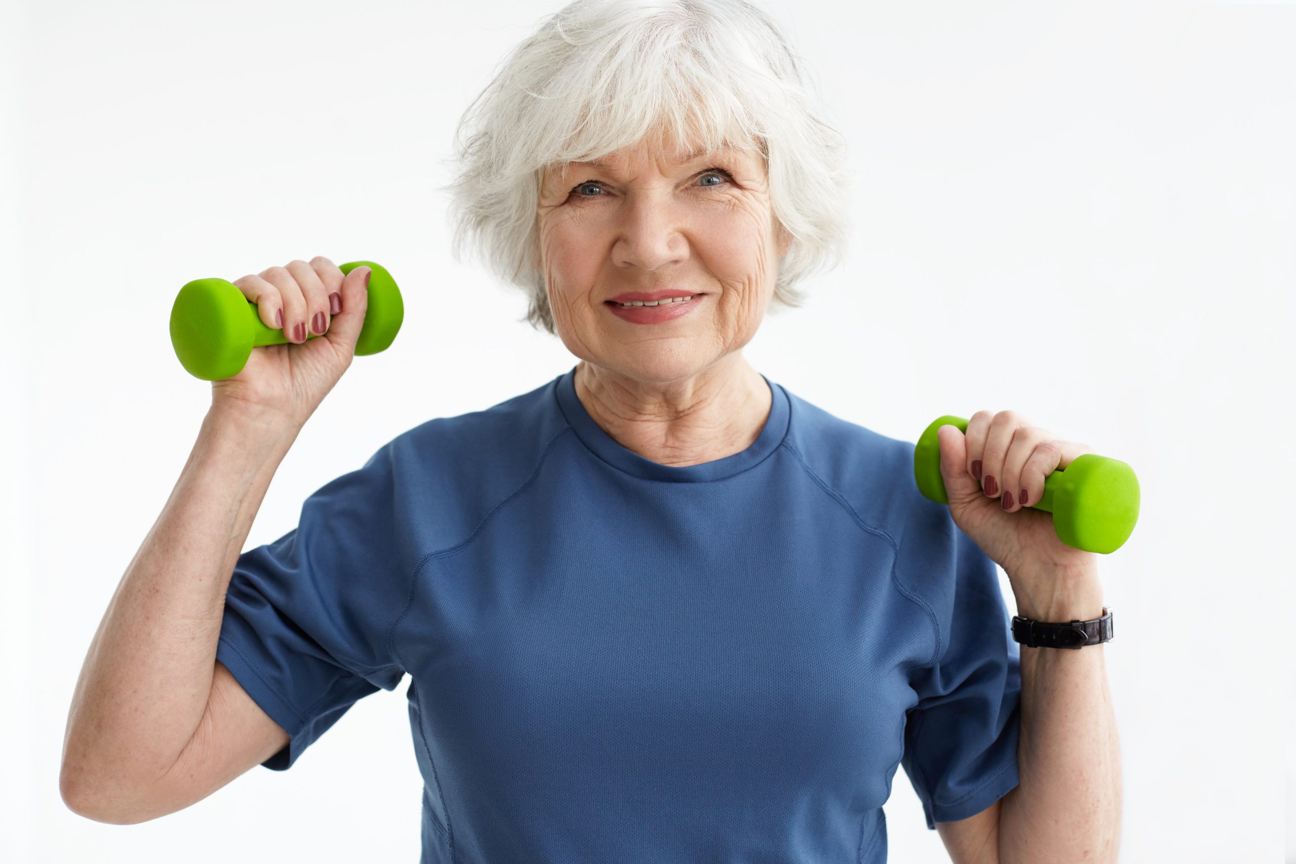 Lady lifting weights | Featured Image for the Osteoporosis Explained Blog by Pivotal Motion Physiotherapy.