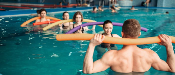 Male instructor conducting a hydrotherapy class | Featured image for Hydrotherapy Physio page at Pivotal Motion Physiotherapy.