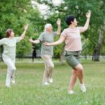 Group of three people execising outdoors | Featured image for the Blood Pressure Exercises page at Pivotal Motion Physiotherapy.
