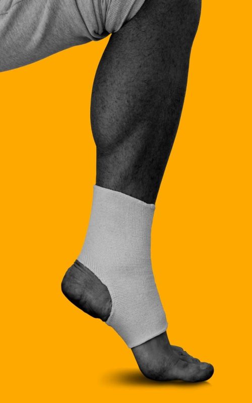 Man's leg in elastic bandage | Featured Image for the Plantar Fasciitis Physiotherapy Page of Pivotal Motion Physiotherapy.