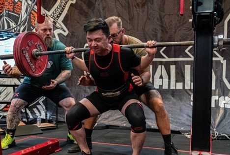 Man competing in powerlifting competition