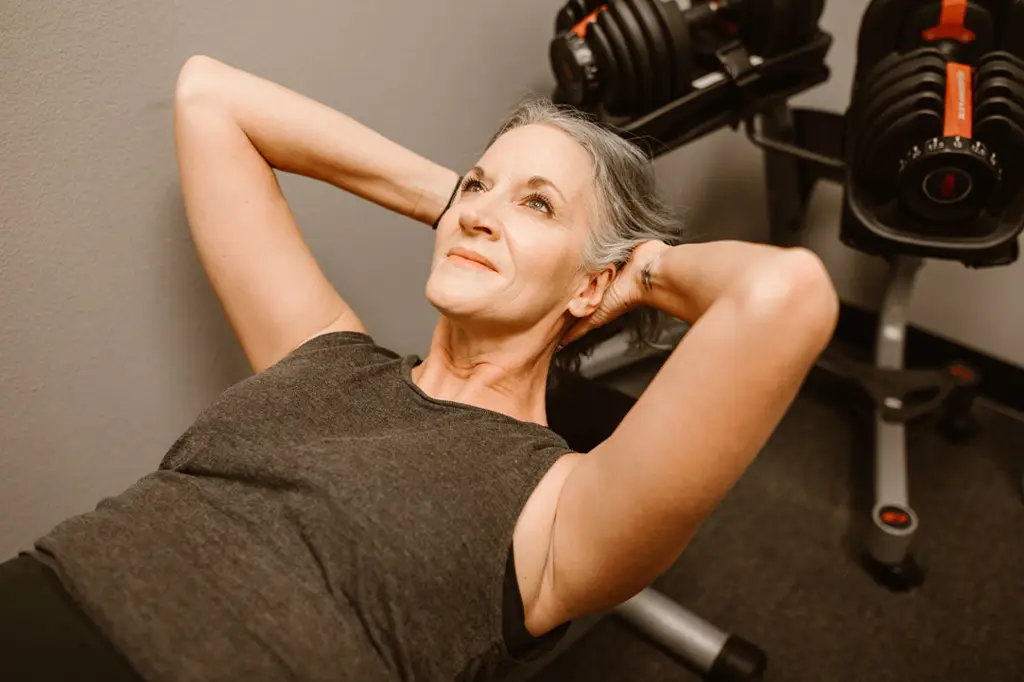 older woman doing situps